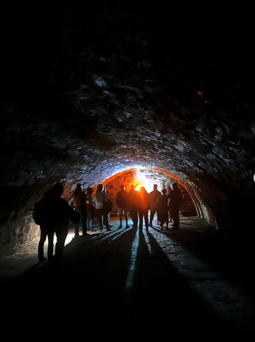 Damp stone walls and low arches on the South Bridge vaults tour